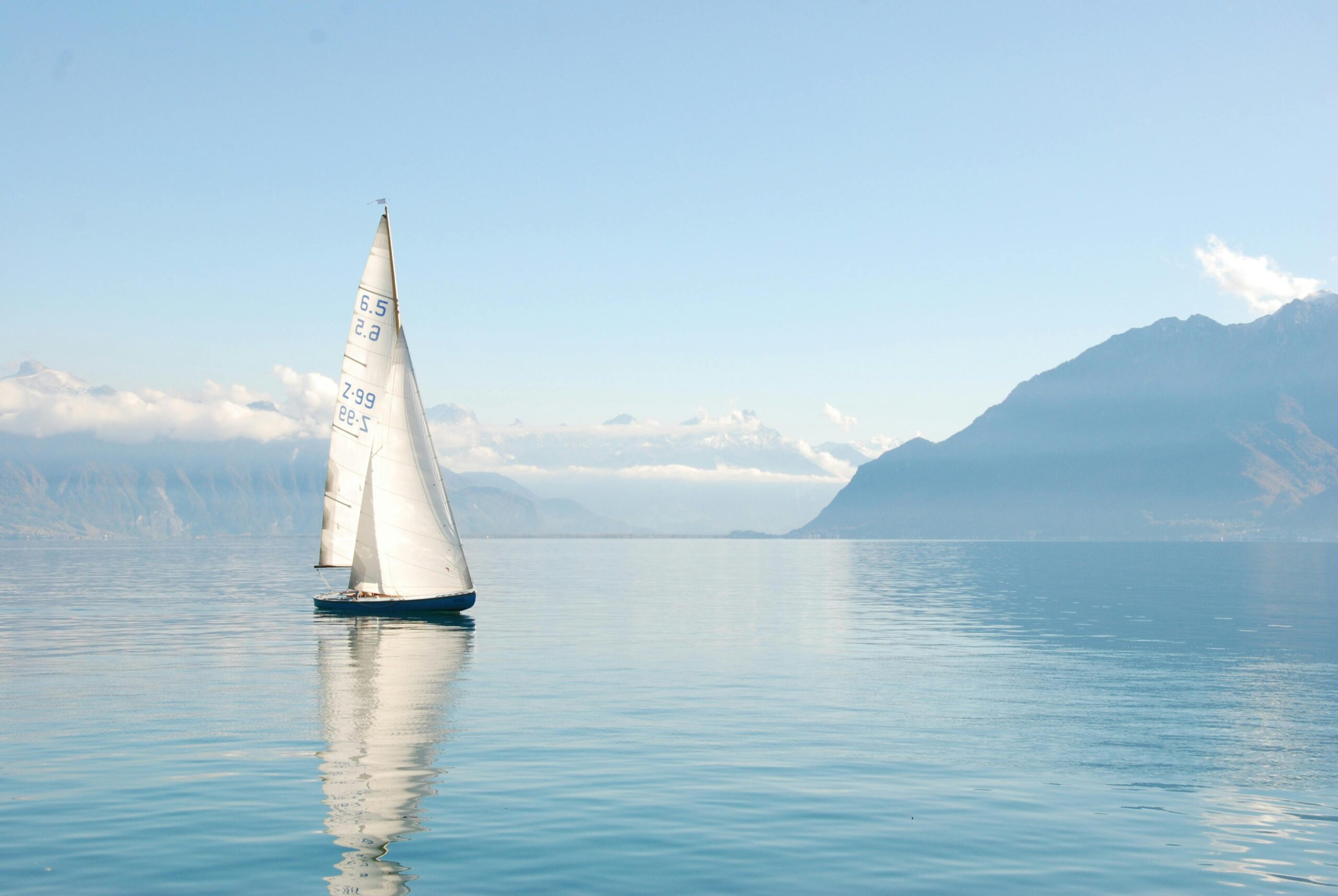 White sailboat on water